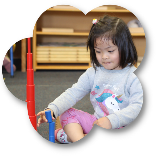 Girl with Montessori blocks at The Children's Corner childcare centre in Howick, Auckland